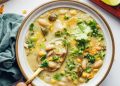 Gold spoon scooping up a bite of our dairy-free white bean chicken chili recipe