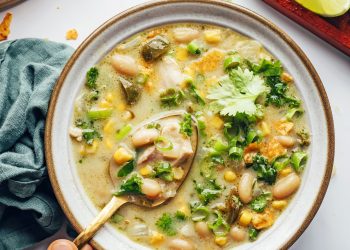 Gold spoon scooping up a bite of our dairy-free white bean chicken chili recipe