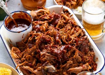 My best pulled pork in a pan with sides ready to be served