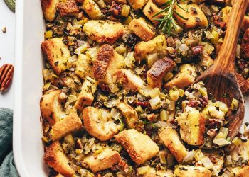 Wooden spoon in a pan of homemade vegan gluten-free stuffing