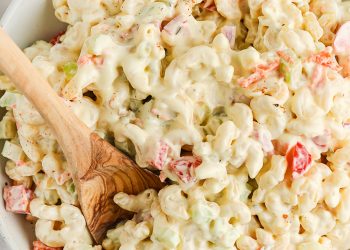 serving macaroni salad with a spoon