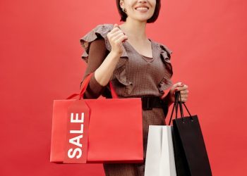 female shopper holding multiple bags