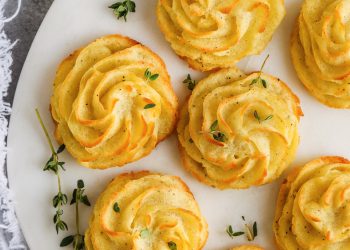 duchess potatoes with herbs on a marble board