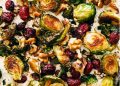 Close-up of Brussels sprouts on pan with walnuts and cranberries