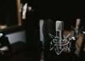 podcast microphone in a dark studio