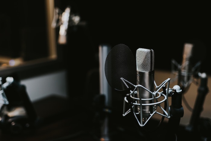 podcast microphone in a dark studio