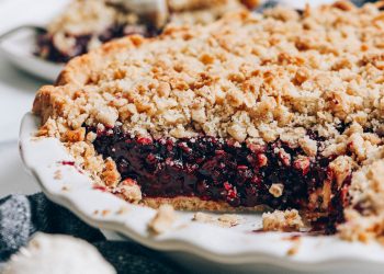 Close up shot showing the jammy center of our mixed berry crumble pie